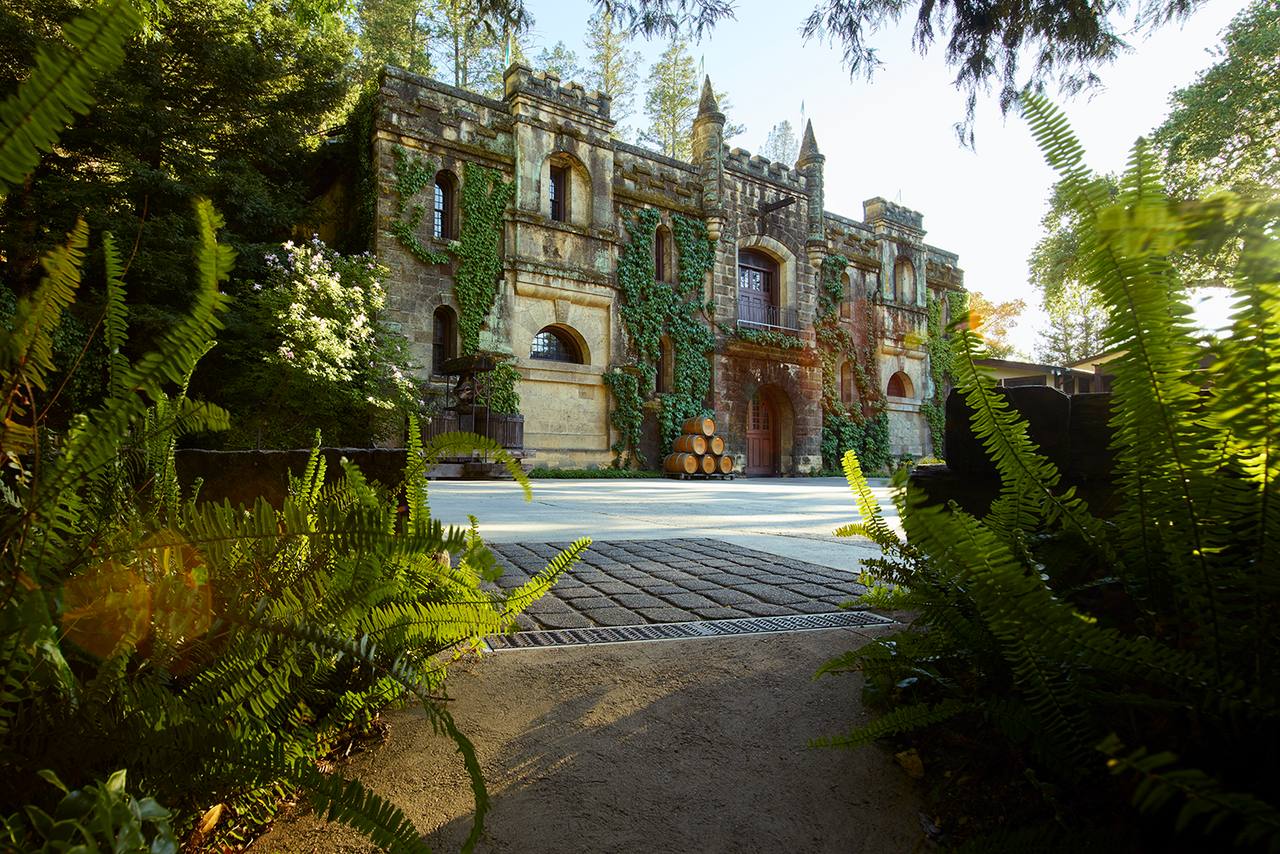 The ivy-covered stone chateau at Chateau Montelena in Calistoga, with barrels stacked by the arched door. Crafton has led winemaking at the estate since 2014 and the whole operation as president since January.