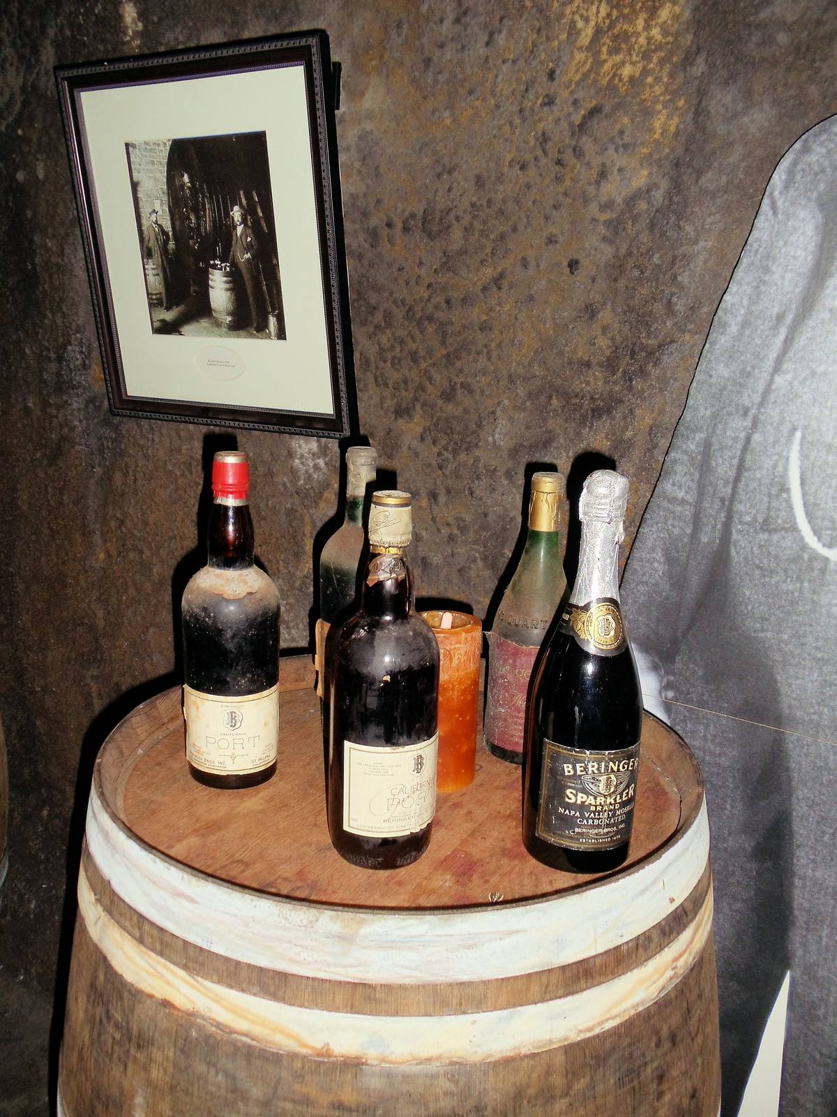 Inside Beringer Vineyards: oak fermenters and old bottles from the winery's cellars. An AVA name on a label is a claim about where the fruit grew, backed by the 85 percent rule.