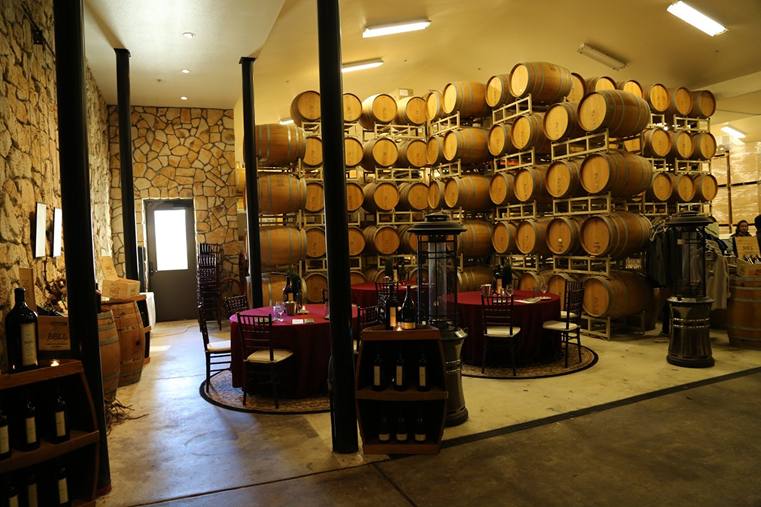 Barrels stack the walls of Bell Wine Cellars' Yountville tasting room.