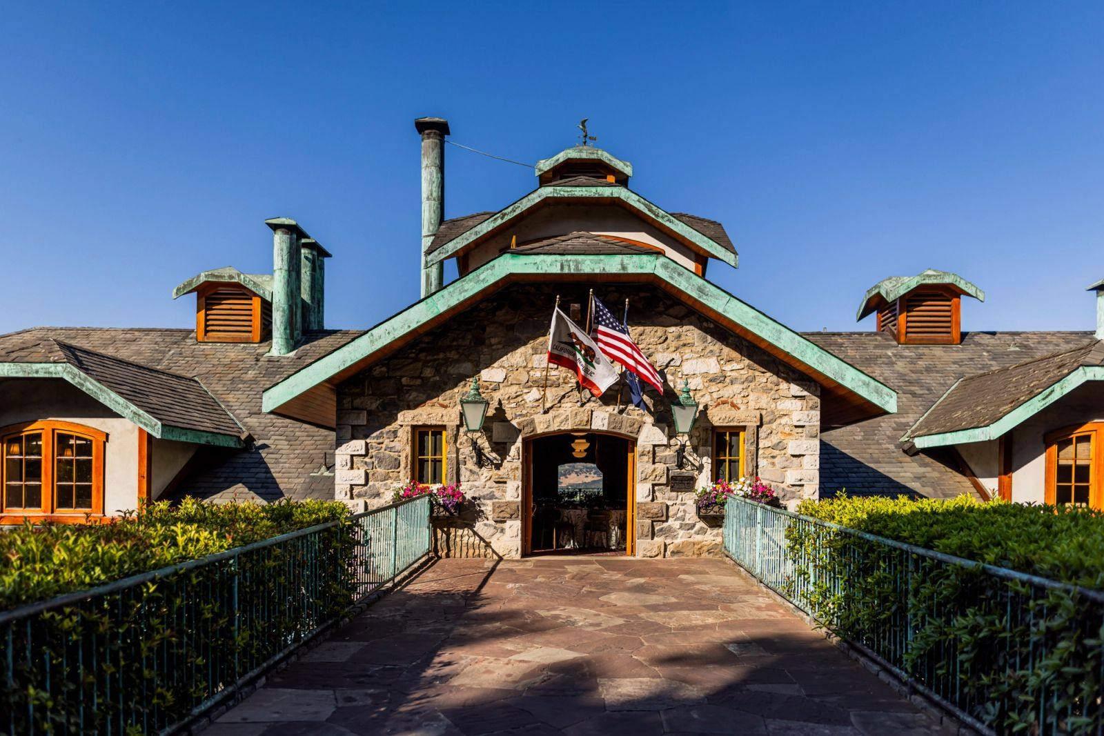 The copper-roofed stone entrance of Far Niente Winery in Oakville.