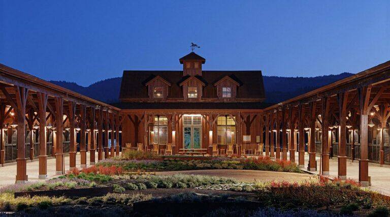 The courtyard of Tamber Bey Vineyards' horse-barn-style winery at dusk in Calistoga.
