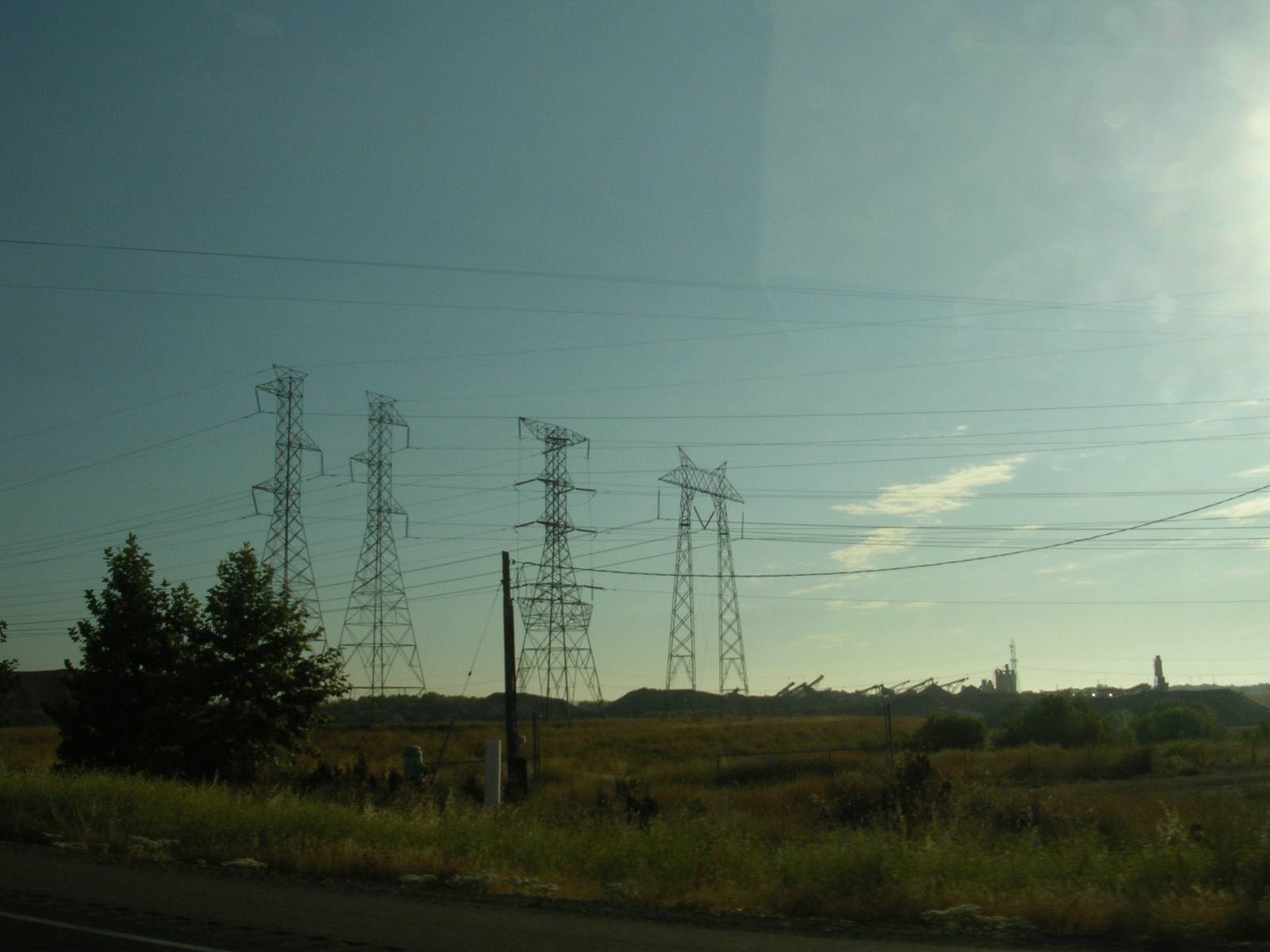 Transmission towers carry lines beside Interstate 505 in California. Before restoring power, PG&E crews patrol and inspect de-energized lines to check for wind damage.