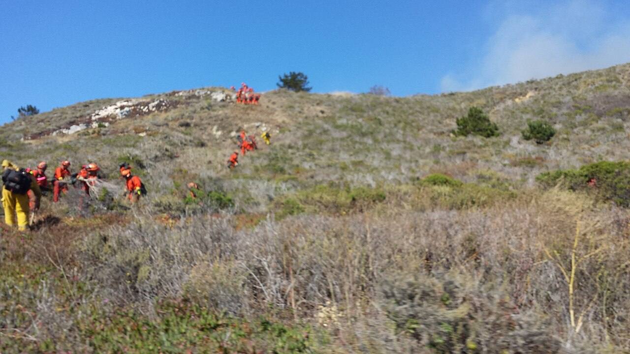 Firefighters work a brush fire line; the Pickett Fire burned 6,820 acres northeast of Calistoga in 2025.